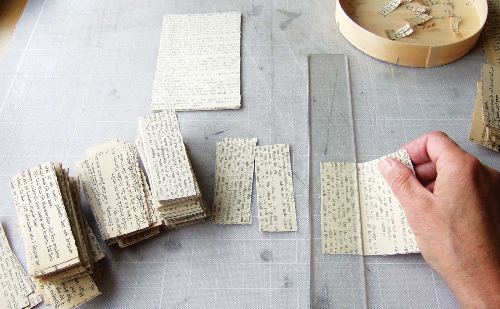 Levy’s slow, methodical papier-mâché process begins with these strips of paper.