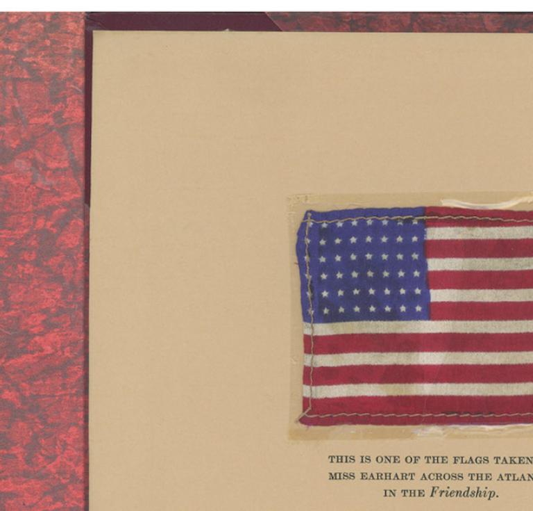 Amelia Earhart book and flag
